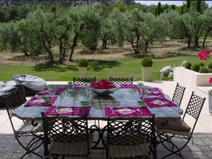 External dining area with a view of the olive grove