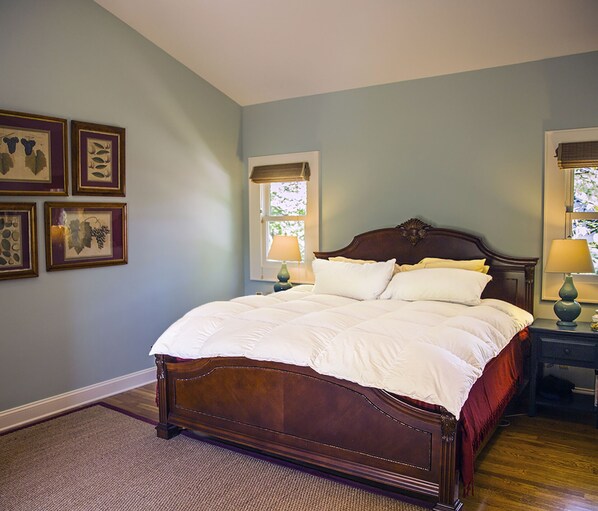 BEDROOM with king size bed under a vaulted ceiling for a restful night.