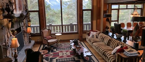 Grandroom with wood burning fireplace and amazing unobstructed Mountain View’s 