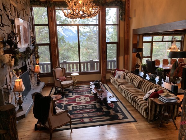 Grandroom with wood burning fireplace and amazing unobstructed Mountain View’s 