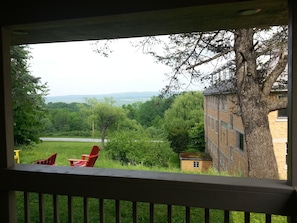 view from front porch looking across nature conservancy and Hemlock Lake