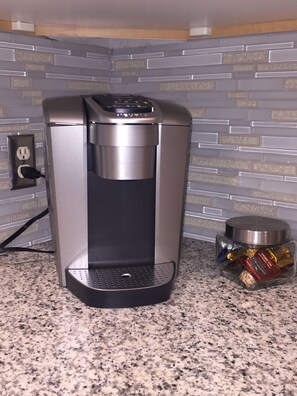 The kitchen includes a Keurig and a traditional coffee maker.
