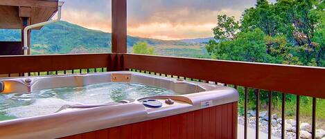 Enjoy a soak in your private hot tub after a long day.