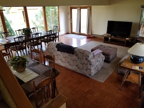 Full wall of windows provides beautiful mountain views while dining or relaxing