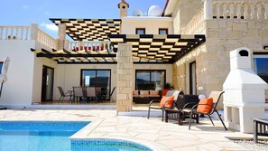 Shaded terrace area overlooking the pool.