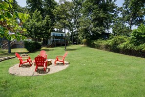 Fire pit is located by the tanning deck and pier.