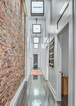 Hallway off of the kitchen leading to the bedrooms and laundry room