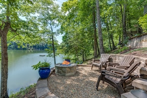 Glass fire pit at waters edge