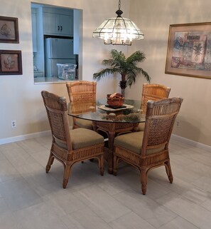 The Dining area is is convenient to the kitchen and has a view of the Gulf