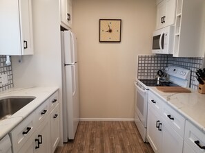 The kitchen is well laid out for preparing vacation snacks and meals.