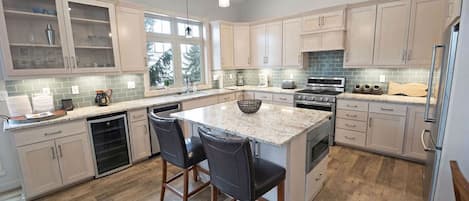 Beautiful open kitchen with stainless steel appliances.