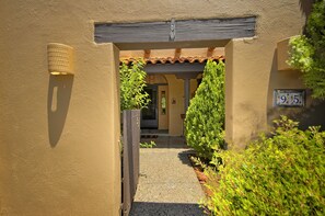 Private courtyard with bench seating and bistro table