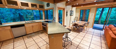 Recycled Glass Countertops, CustomOak Slab Table &10' WIndow Overlooking Creek