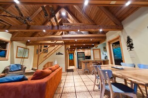 Downstairs Living Area and Dining Area Looking Up at Loft