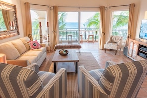 Beautifully furnished living room with sweeping ocean views.