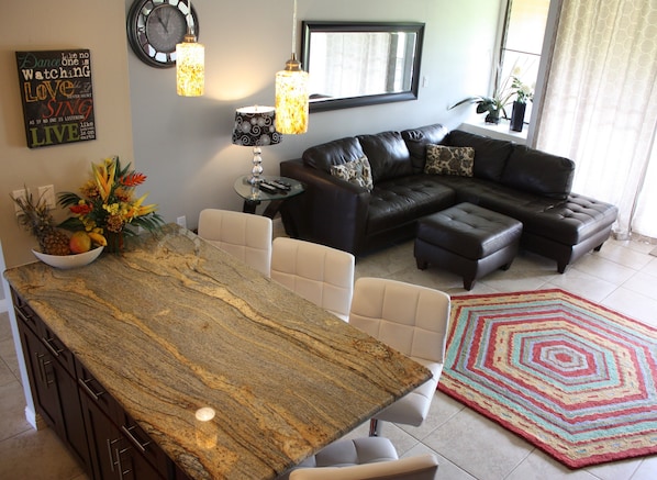 Open concept kitchen that leads into living room. 