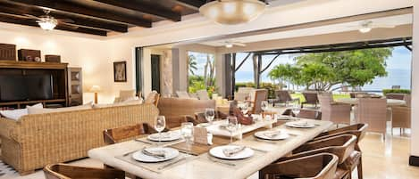 Dining room & family room overlook patio, pool and ocean.