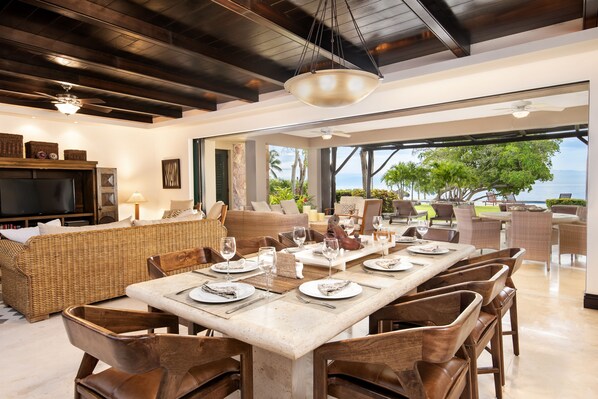 Dining room & family room overlook patio, pool and ocean.
