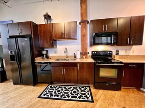 Full kitchen with standard coffee maker.