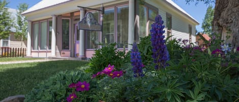 The flower beds in summer are a work of art. Sit on the log bench and enjoy!