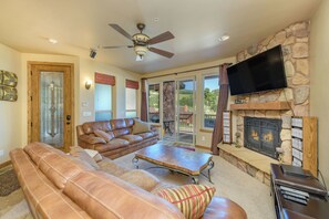 Cozy living room with beautiful view off balcony.  Fireplace & 55" Smart TV