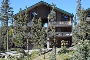 Condo is surrounded by mountain pines.  Has a garage for your auto and gear.  