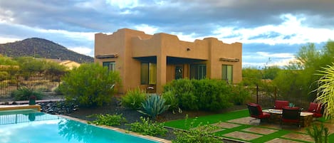 front view of casita, pool and fire pit.