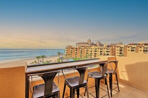 53  Bar top seating on the main floor patio. Best seats in the House :)