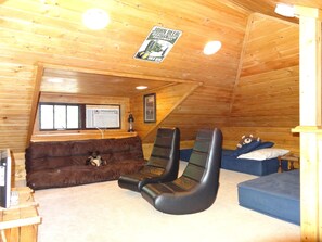 Loft-better view of the 3 twin PB Teen futon beds+2 gaming seats+flat TV's+A/C

