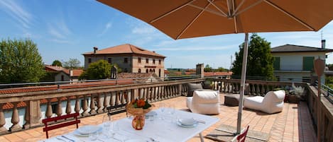 our charming terrace with a view to Pontemanco and our Euganean Hills