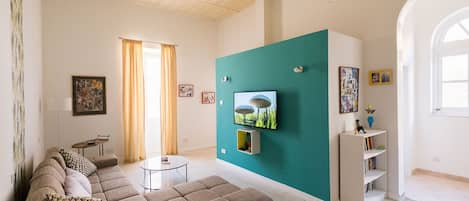 Upstairs living room with large-screen TV.