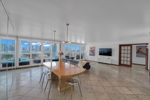 Dining area with seating for 6, living room, Roku tv, balcony access