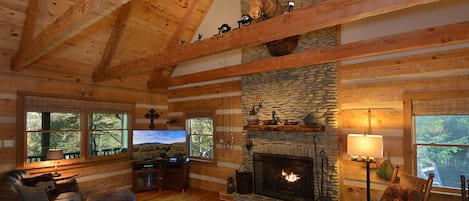 Towering stone fireplace w/ massive gas logs featuring Connor, our beloved moose