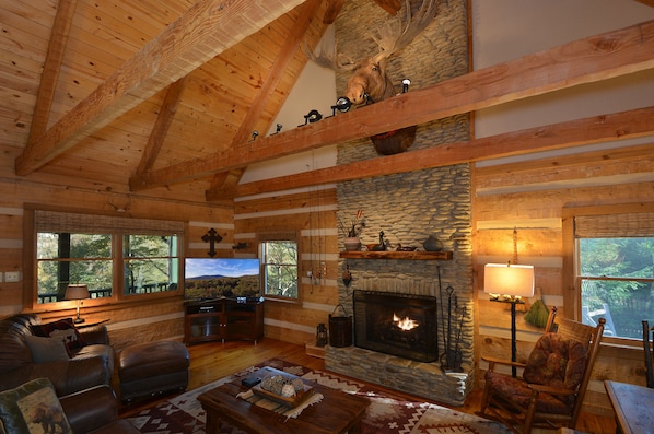 Towering stone fireplace w/ massive gas logs featuring Connor, our beloved moose