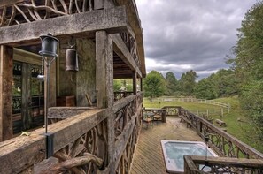 Nice covered porch over looking Hot tub