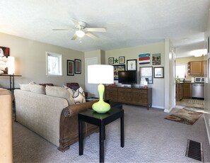 Charm exudes with tons of natural light in the living area!