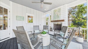 Beautiful outdoor gas fireplace- Screened rear porch with seating