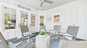 Beautiful outdoor gas fireplace- Screened rear porch with seating