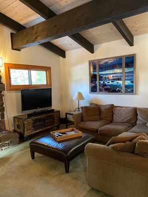Upstairs living area with access to sunny back deck. 
