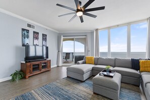 Living room; 60" 4k Roku TV, oversized sectional sofa. 