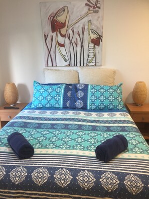 Front upstairs bedroom has awesome outlook at travelers Palms in driveway