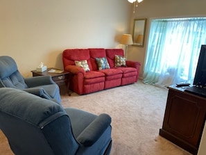 Living Room with Smart TV, Couch with 2 Recliners plus 2 Individual Recliners