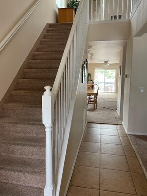 Entry Hallway. Stairs to 2nd Flr Bedrms, Bathrms, WorkDesk, Game Closet, Laundry