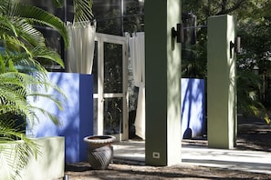 Main entrance to front yard caged pool and lounge, South Beach inspired. 