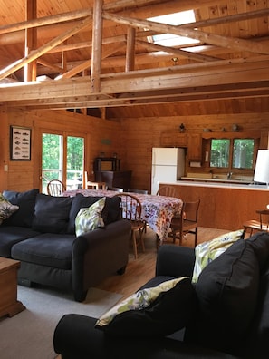 Log home interior with a great room, open floor plan.