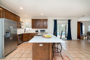 Open, specious, and fully stocked kitchen
