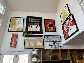 Homeowner displays his own original JDWise art for spectacular living room view