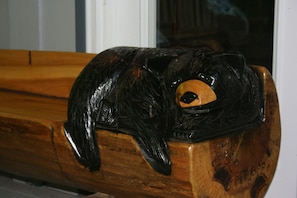 Bear bench on porch