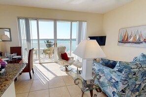 Living Room Area with Balcony Access, Large Flat Screen TV and Free Cable TV. Full Size Premium Sleep Sofa