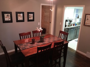 Dining table has a leaf built in that folds out.